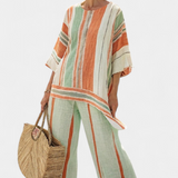 Elisabetta – top assimétrico elegante e calças de perna larga