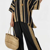 Tamara – top às riscas oversized confortável e calças relaxadas