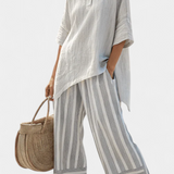 Fiorella – blusa assimétrica elegante e calças riscas