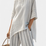 Fiorella – blusa assimétrica elegante e calças riscas